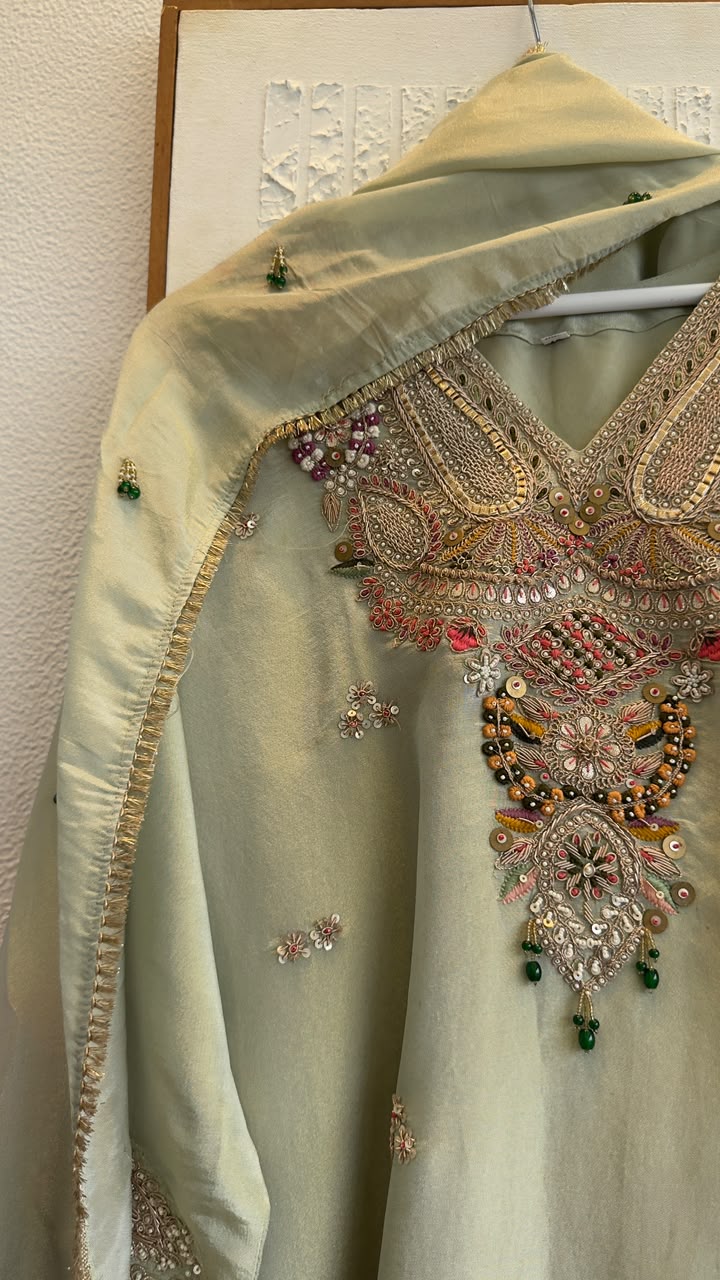 Premium classy tissue suit with jewl work on duo with heavy zardozi kaam