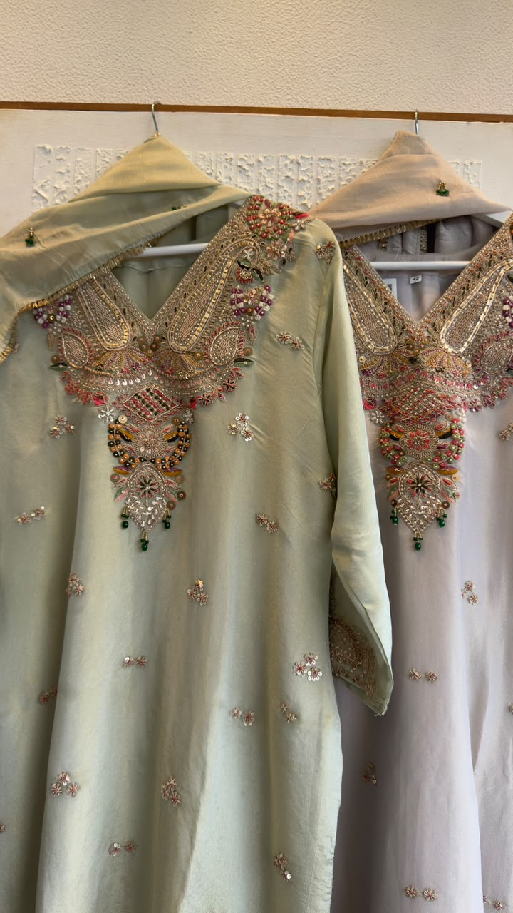 Premium classy tissue suit with jewl work on duo with heavy zardozi kaam
