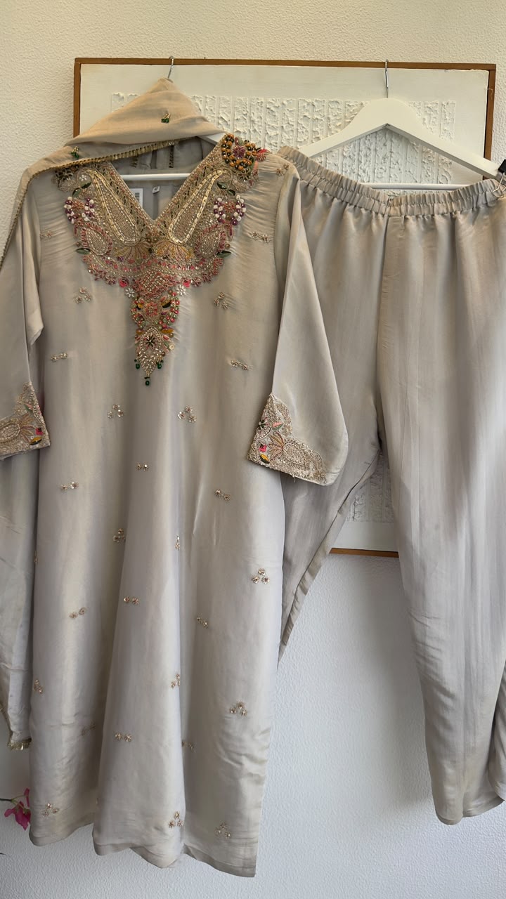 Premium classy tissue suit with jewl work on duo with heavy zardozi kaam