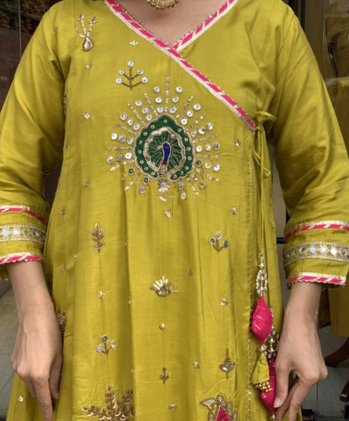Silk angrakh peocoak anrakali with gota detailing paired with organza dup & silk pants