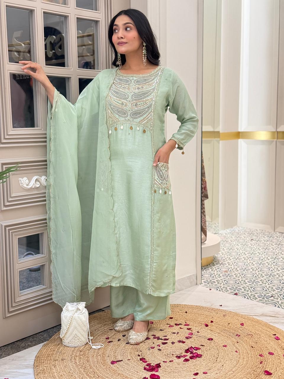 Pista green real pocket Dola silk suit with zari handwork paired with organza Dupatta silk pants